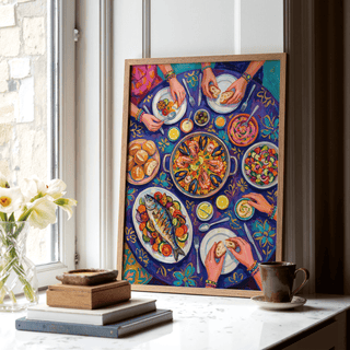 Print leaning on a shelf featuring a Mediterranean feast with blue and purple tones by a window with flowers