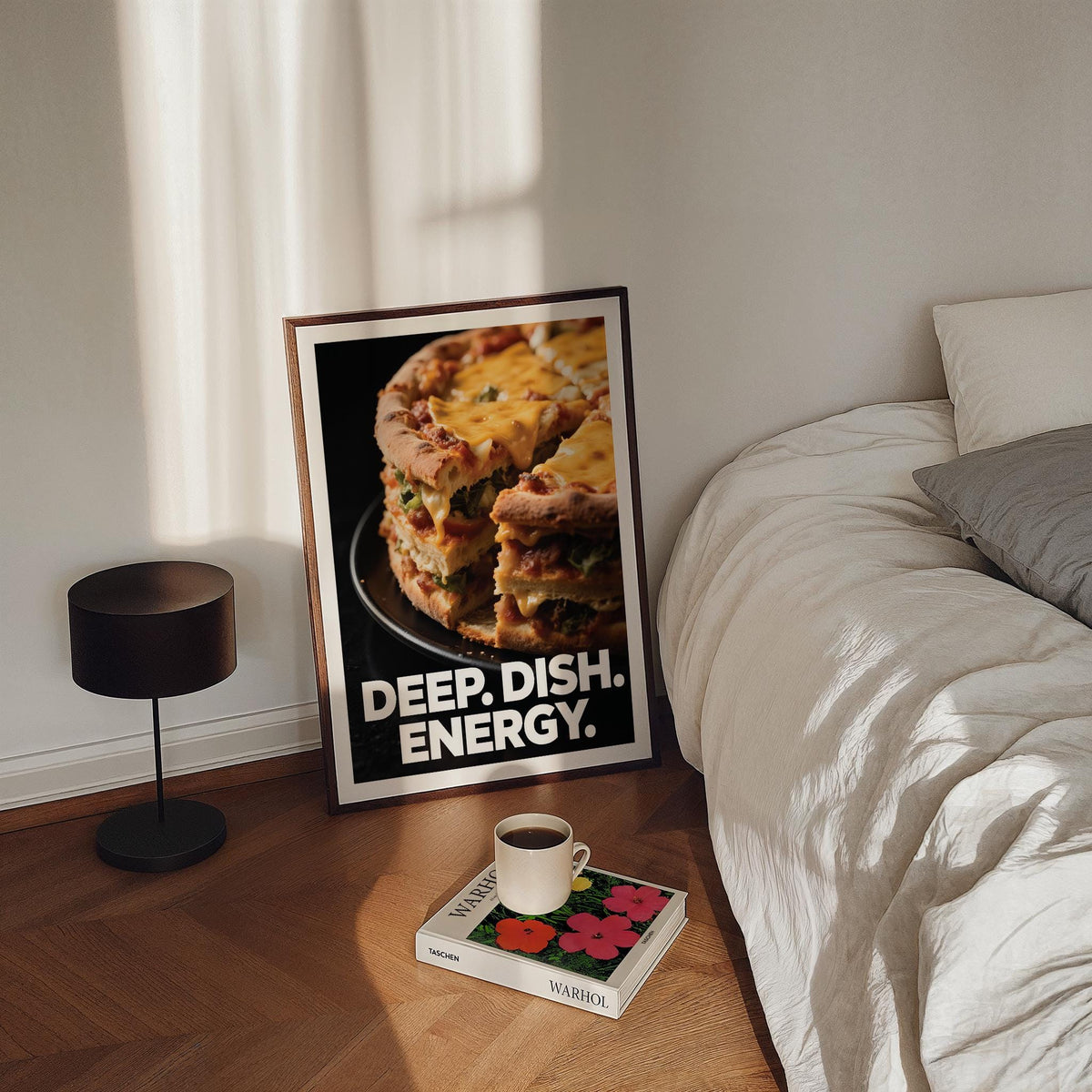Foodie Gift Idea print leaning on floor near a bed and black lamp with coffee cup on a book
