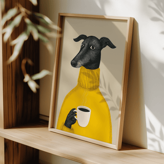 Print leaning on a shelf of a black dog in a yellow sweater holding a steaming cup with plant shadows