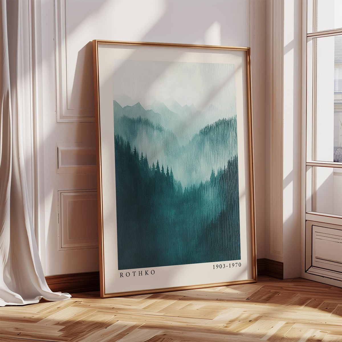 Framed mountain wall art of abstract misty mountain range in teal and grey leaning by window