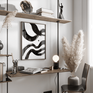 Black and White Paintings Abstract in a modern study with black ink waves in a wooden frame above a desk