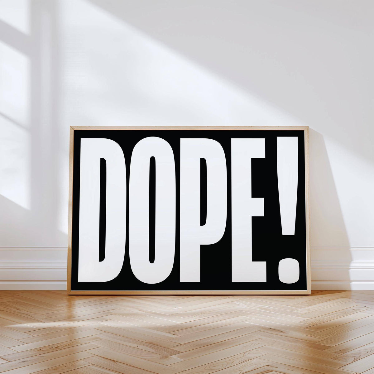 Bold Font Poster leaning on floor with black and white dope typography in natural light