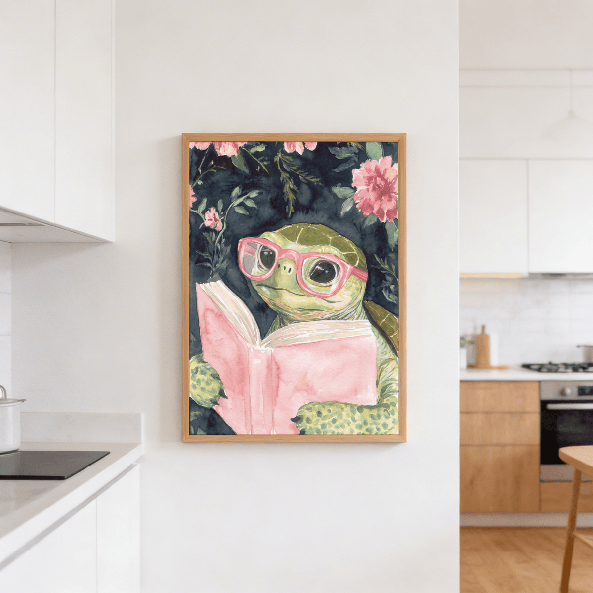 Turtle reading art print in watercolour of a turtle with pink glasses and book hanging in a kitchen