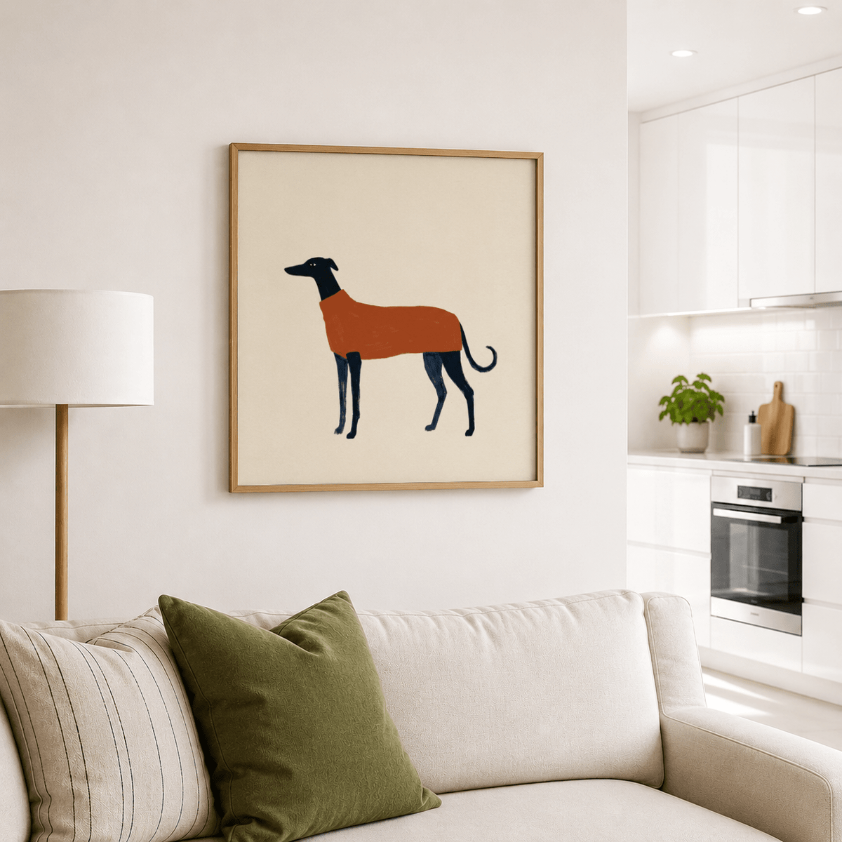 Greyhound art print of a greyhound dog wearing orange sweater above a sofa in a kitchen lounge