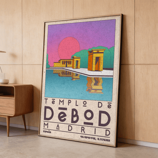 Print leaning on floor of Templo De Debod Art Print with pink sun and blue water by a wooden sideboard
