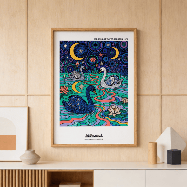 Framed Swan Art Print of swans in a colourful water garden above a sideboard with ceramics