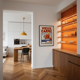 New Orleans Cocktail Print on a wall with an orange-lit shelving unit and wooden cabinets nearby