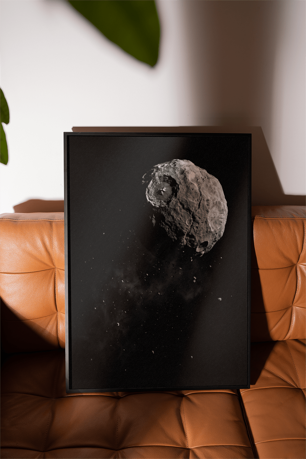 Mars Art photographic print of an asteroid with crater leaning on a brown leather sofa