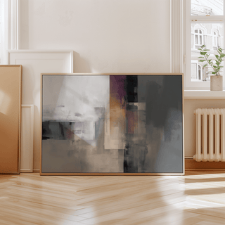Contemporary poster leaning on wooden floor near radiator with abstract geometric shapes in muted colours