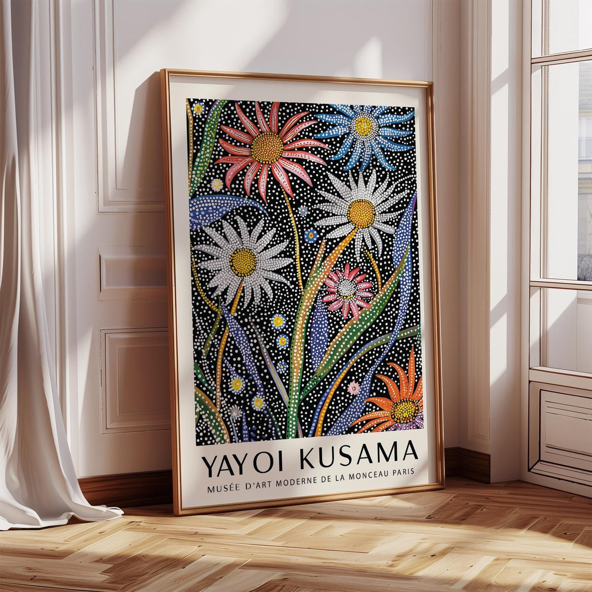 Abstract botanical wall art with dotted flowers in red blue and white leaning on a skirting board