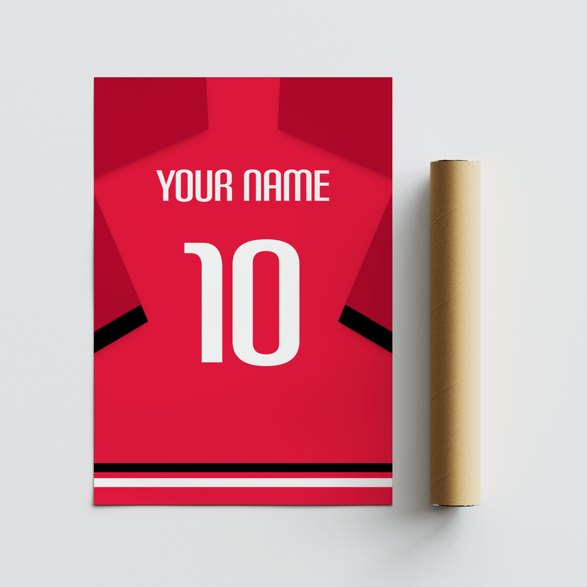 Rolled print with packaging tube of a red football shirt with black sleeve stripe and white number on a grey surface