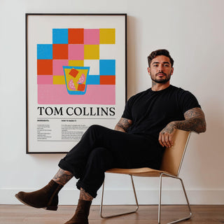 Colorful Bar Prints Tom Collins wall art in minimalist style with bright squares and a cocktail glass beside a seated man
