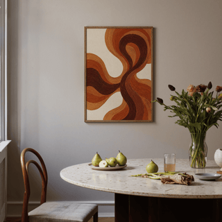 Organic Line Poster with flowing brown and orange lines on a dining room wall above a marble table with pears