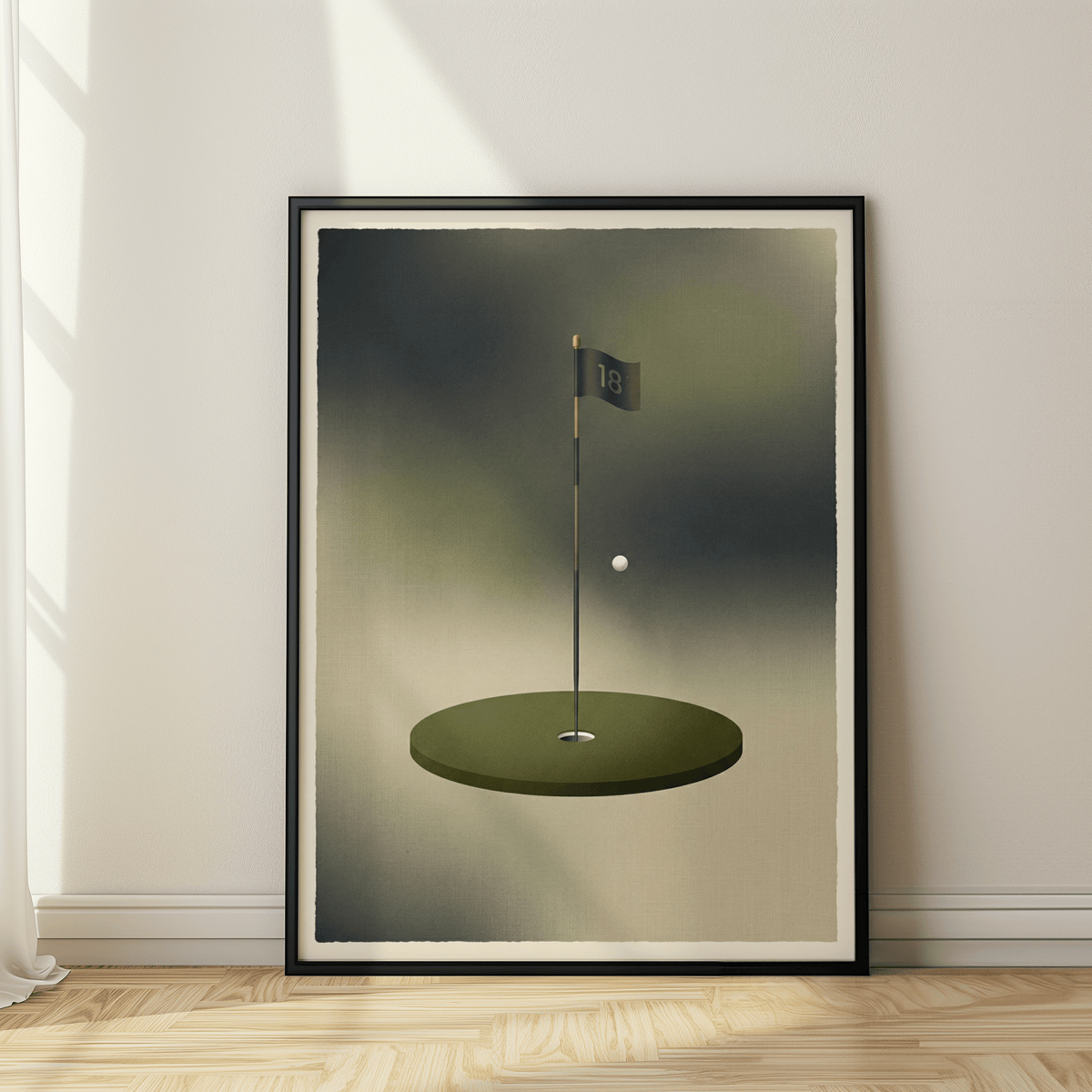 Framed minimalist golf wall art showing a green fairway hole flag and ball leaning on a wooden floor