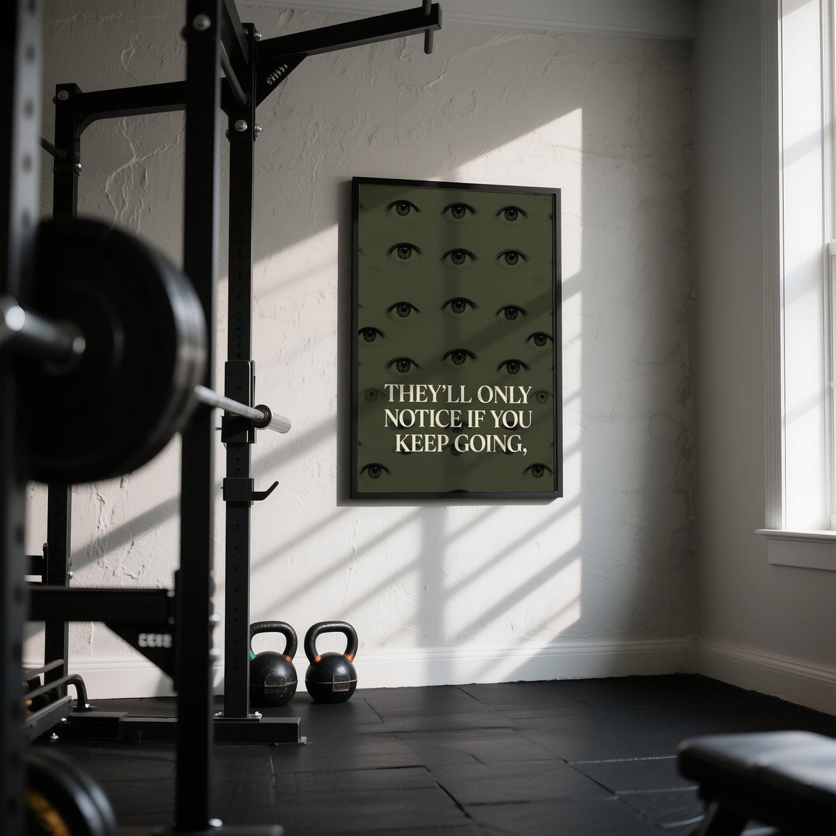 Gym Artwork wall art with human eyes and a motivational quote in olive green gym room with kettlebells
