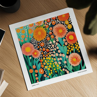 Colourful flower art showing bright abstract pink and orange blooms on a desk