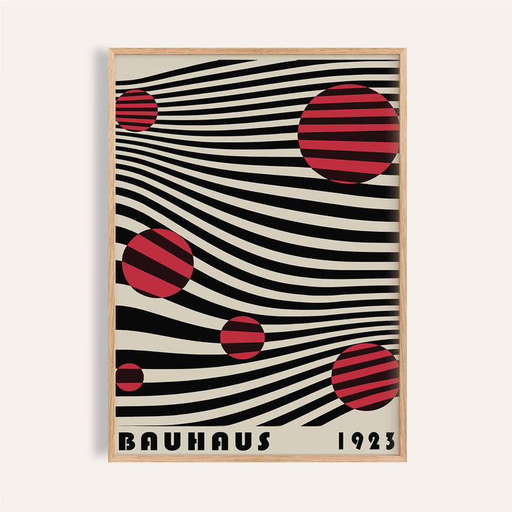 Framed close-up of Large Bauhaus Wall Art with red striped circles on black wavy lines