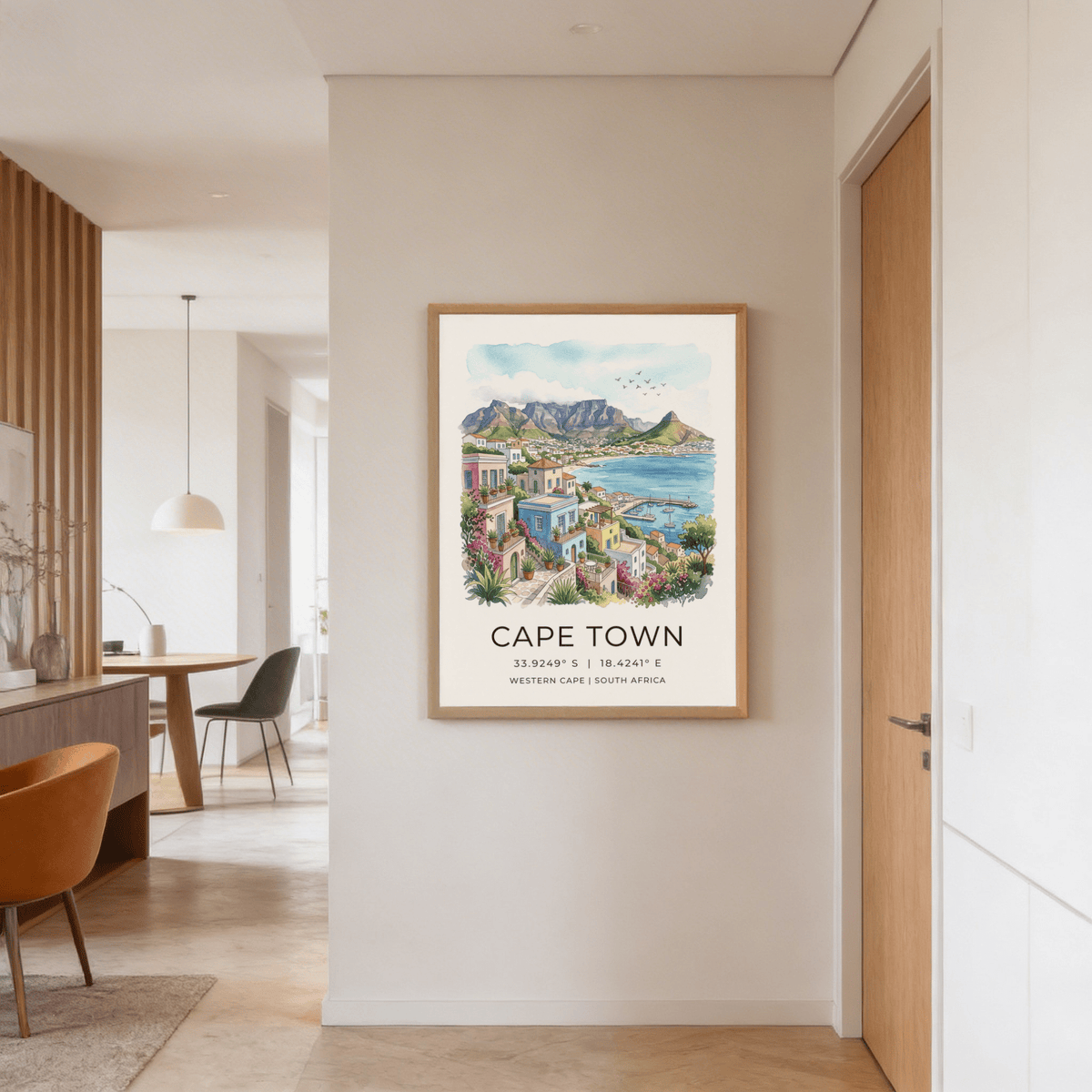 Cape Town art print of colourful houses and coastal landscape on a hallway wall