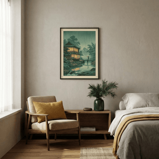 Japanese Landscape wall art of a traditional house in rain above a wooden sideboard with a leafy plant vase in a bedroom