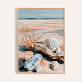 Framed coastal shell art with seashells and dried plants in muted blues and browns