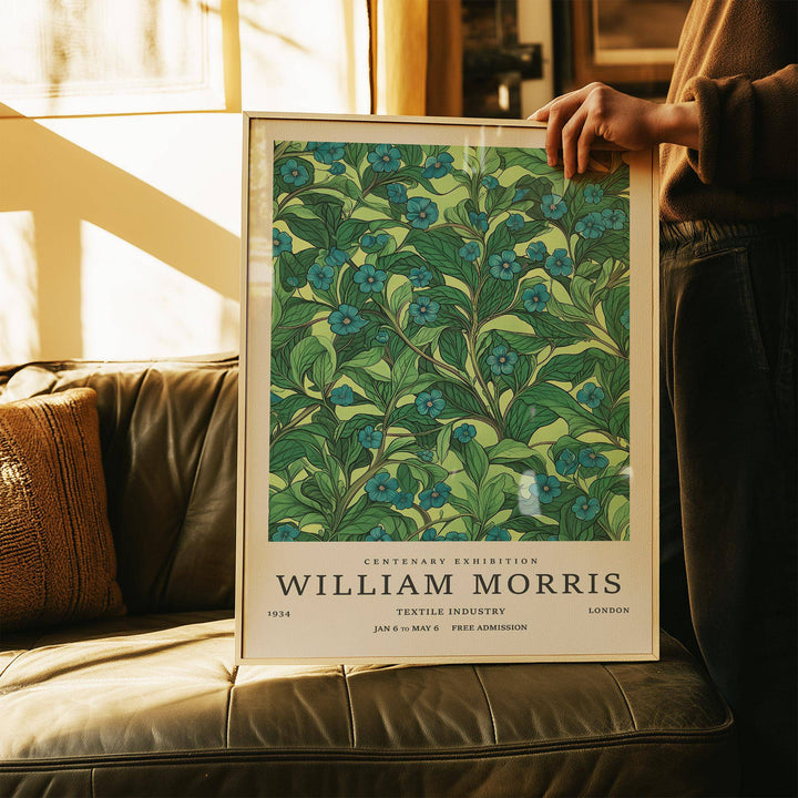 Framed print close-up of green wall art for living room with blue flowers on a green branch