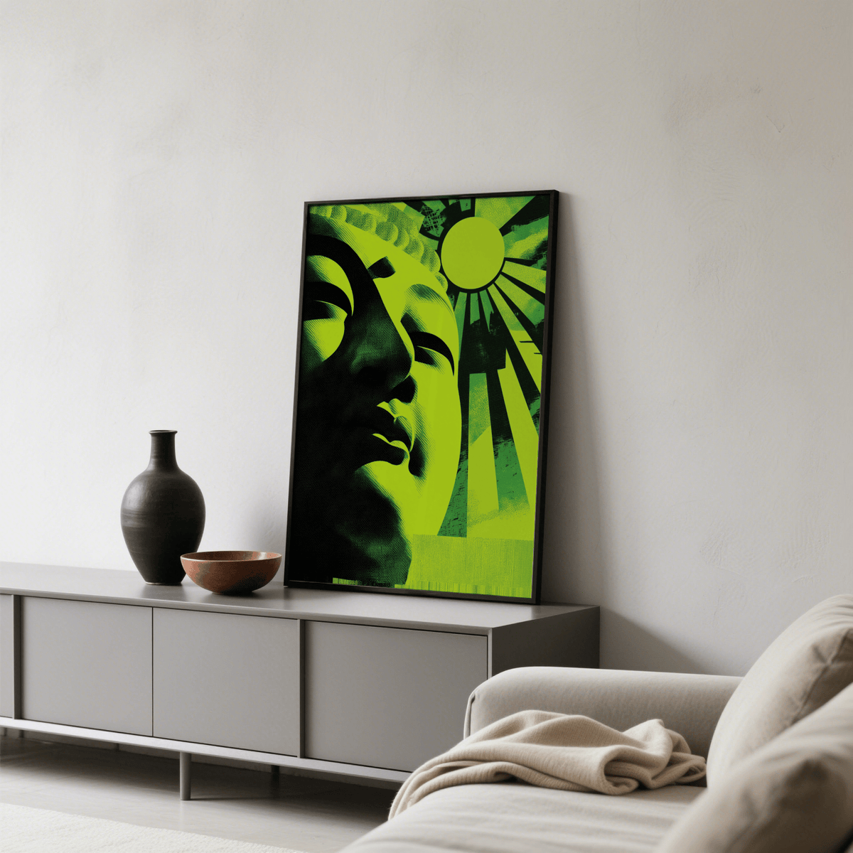 Zen Face wall art leaning on cabinet with a dark vase and bowl in a neutral lounge