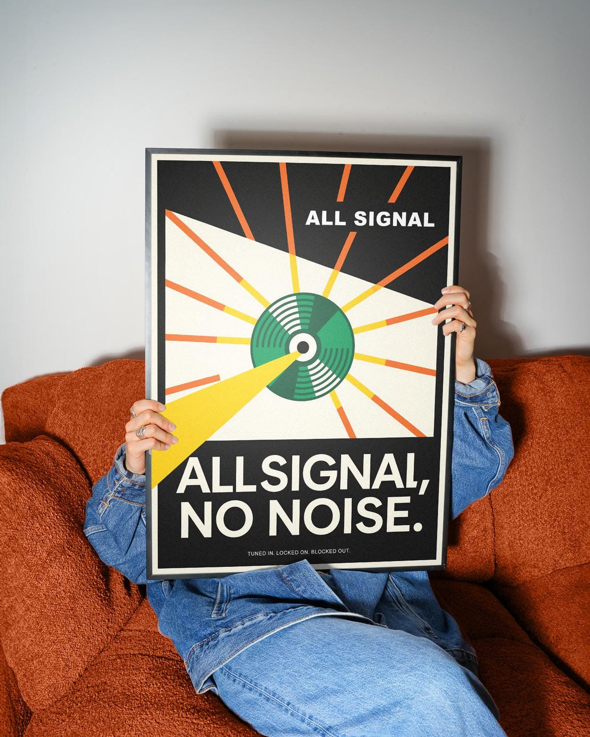 Vinyl Record Poster held in hands showing signal radar design with orange, green, and yellow colours