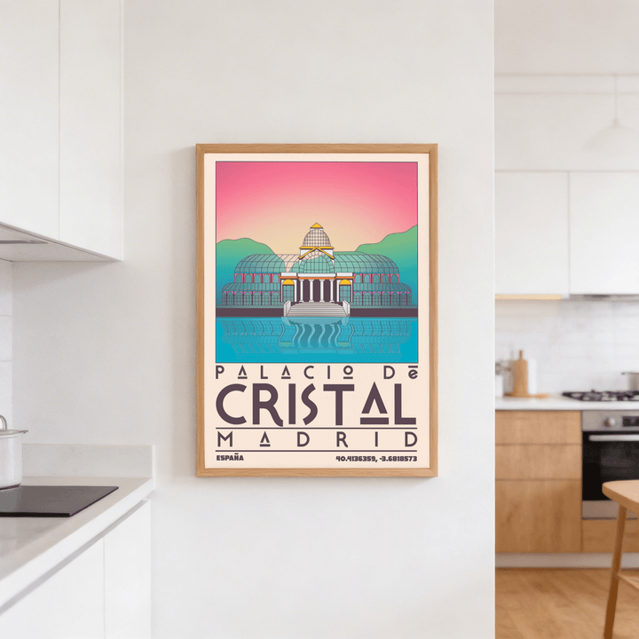 Framed Palacio De Cristal print with pink sky and turquoise details hanging in a kitchen