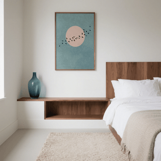 Wall Art Birds print of black birds flying in front of a pink circle on a blue background in a bedroom