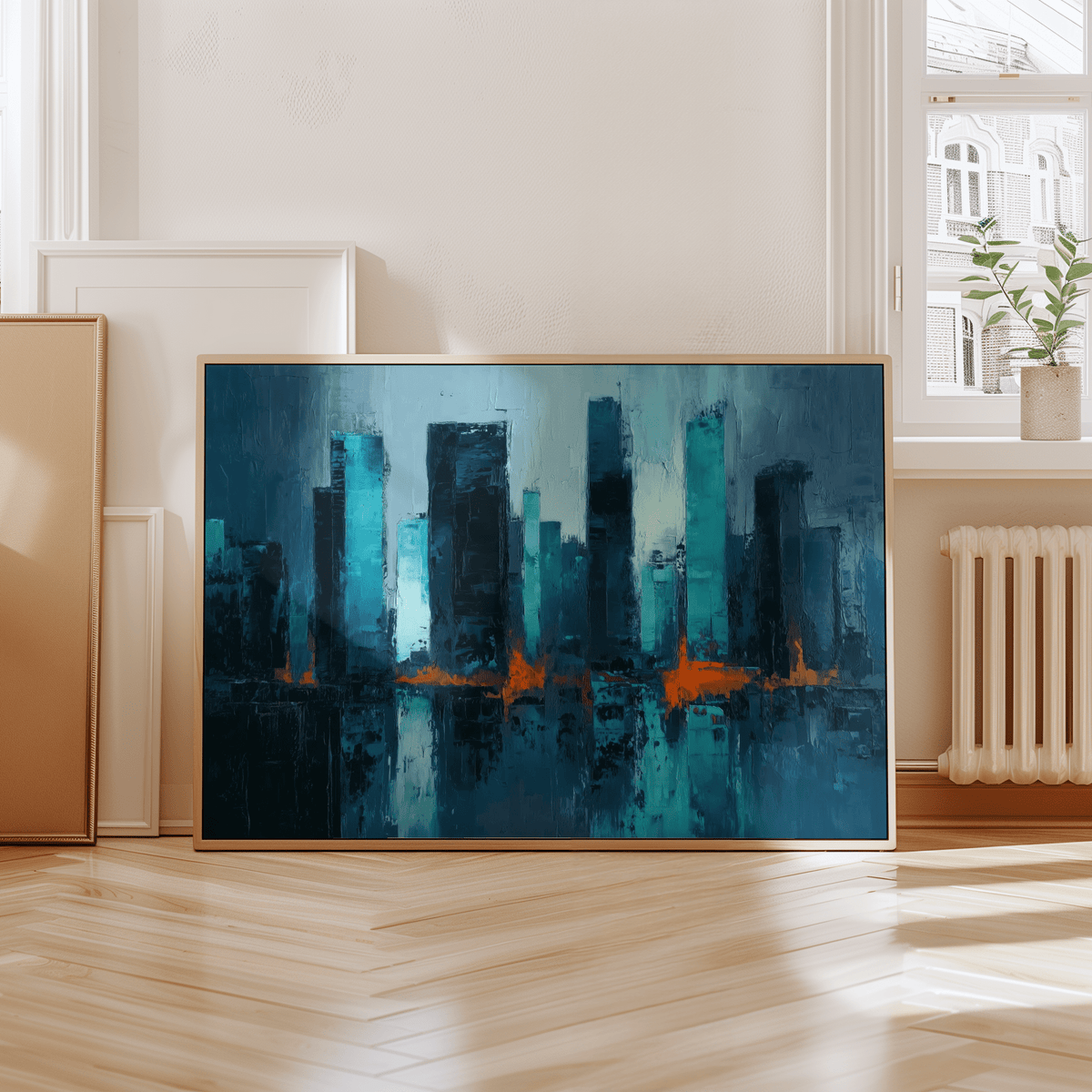 Blue artwork city skyline with blue and orange abstract reflections leaning on a wooden floor near a window