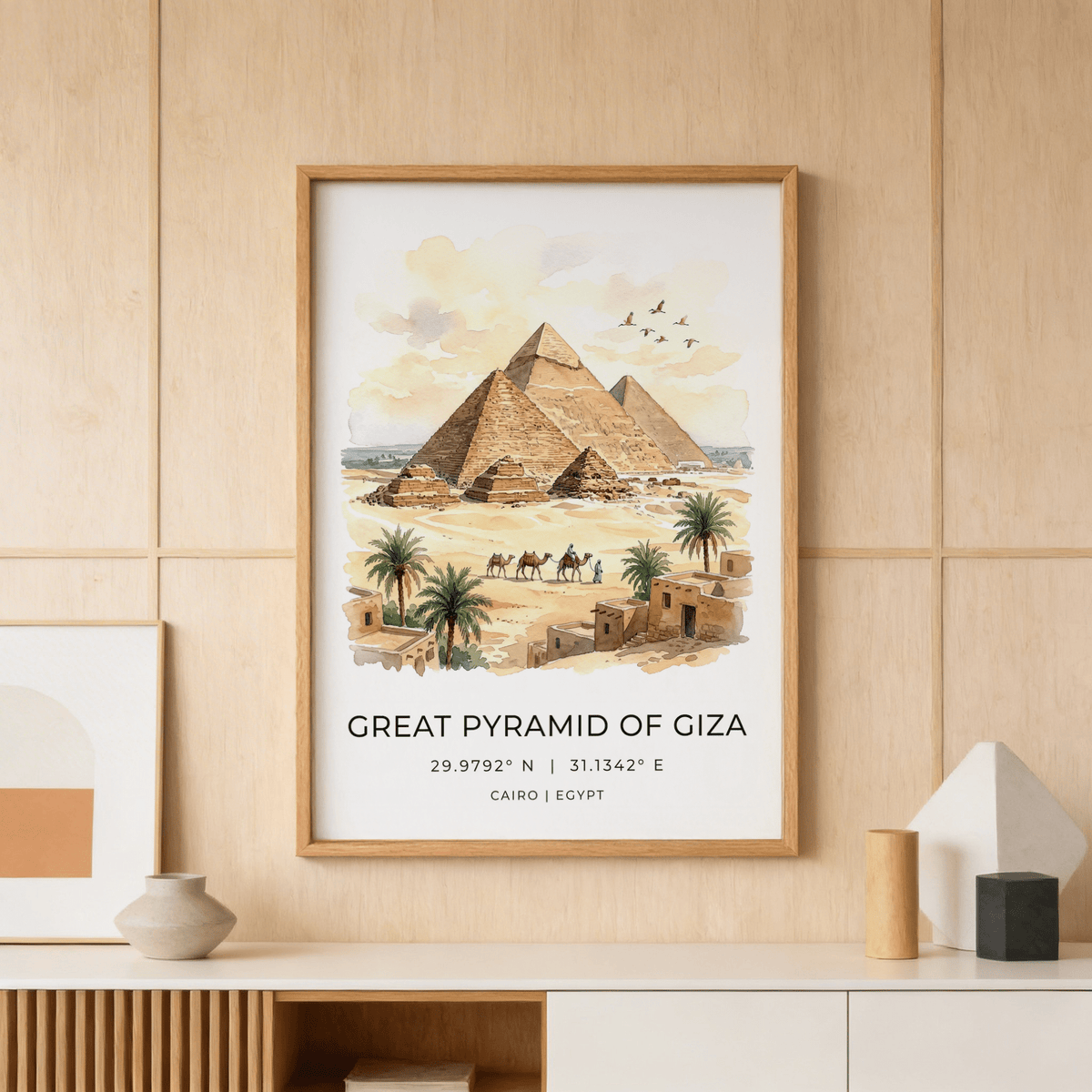 Framed Giza Pyramid wall art showing the great pyramids with camels and palm trees on a wooden wall