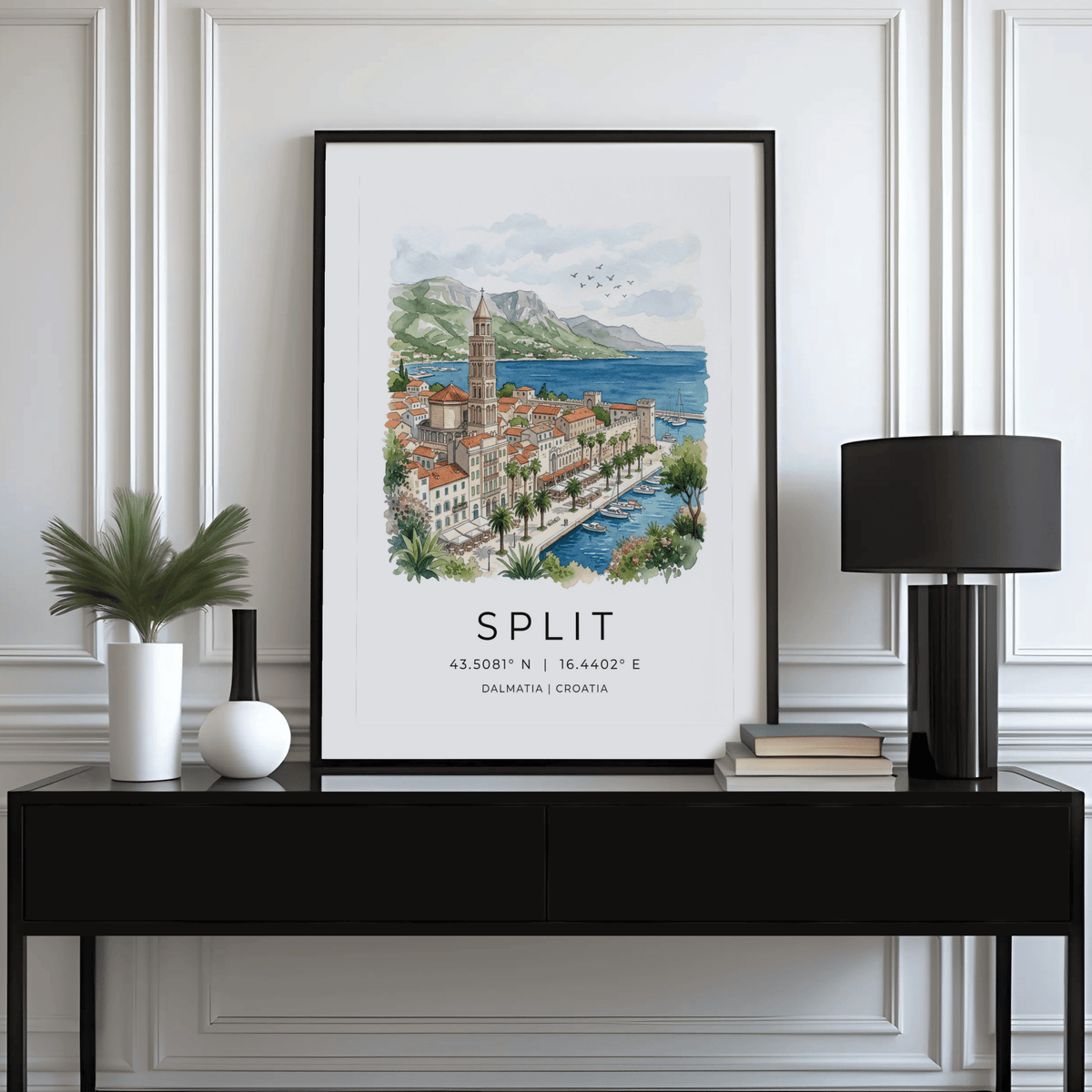 Split Dalmatia art print of a palm tree harbour scene in watercolour above black console with lamp