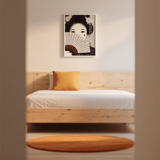 Japanese Geisha Art print with black white and orange hues above a bed with an orange cushion