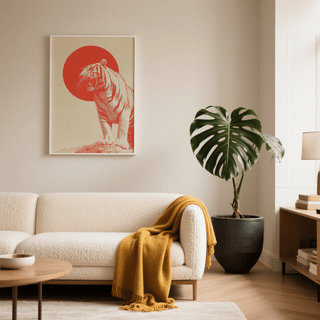 Bold Tiger wall art of a minimalist roaring tiger with red sun above a cream sofa in a living room