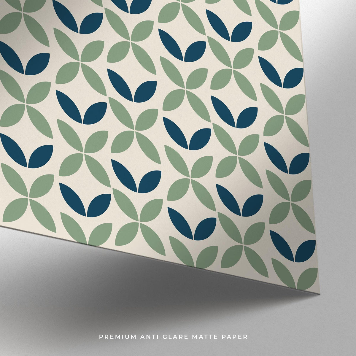 Close-up of blue and green geometric leaf pattern on textured matte paper