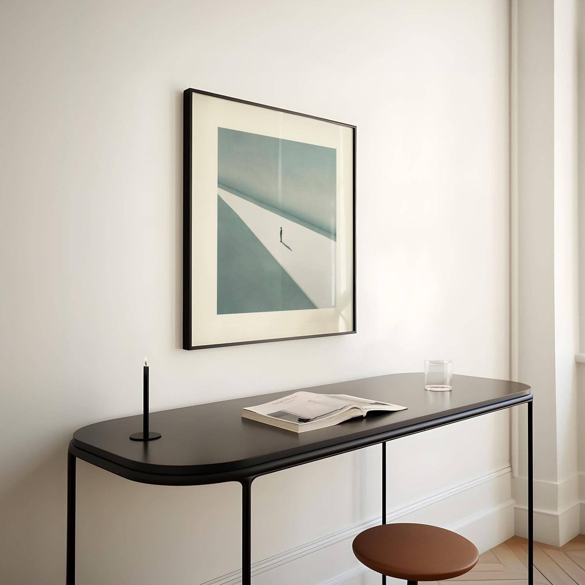 Art Prints Square framed print of a solitary person in shadow with beige and blue tones above a black console table