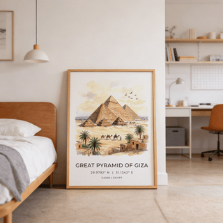 Giza Pyramid wall art leaning on floor near a bed and desk in a light bedroom