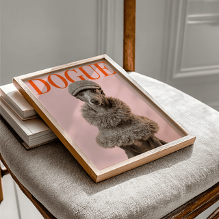 Framed Dressed Up Dog print of a greyhound in a tweed hat on a beige cloth chair with books