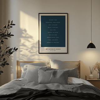 Custom Song Wall Art in a bedroom with navy blue and white minimalist typography above a bed with striped pillows