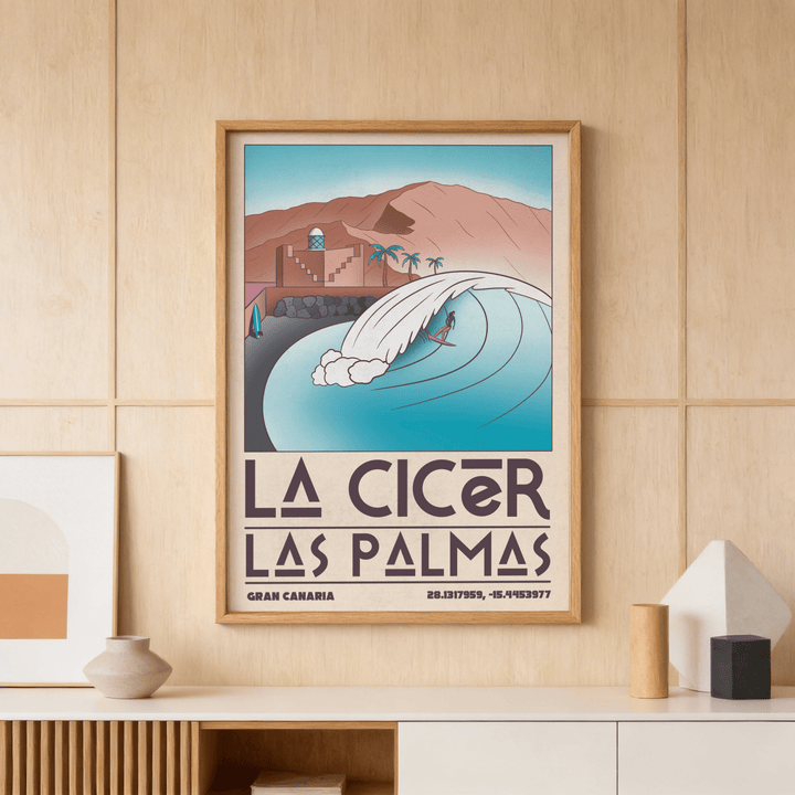 Framed Las Palmas wall art of a surfer on a wave in muted blue and brown tones above a shelf with pottery