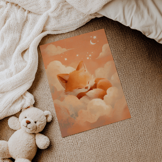 Sleeping Fox Art Print on a carpet with a teddy bear beside it and a cream knitted blanket nearby