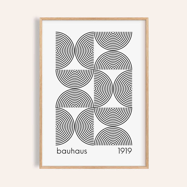 Framed Bauhaus wall art featuring black concentric semicircles and text on white background