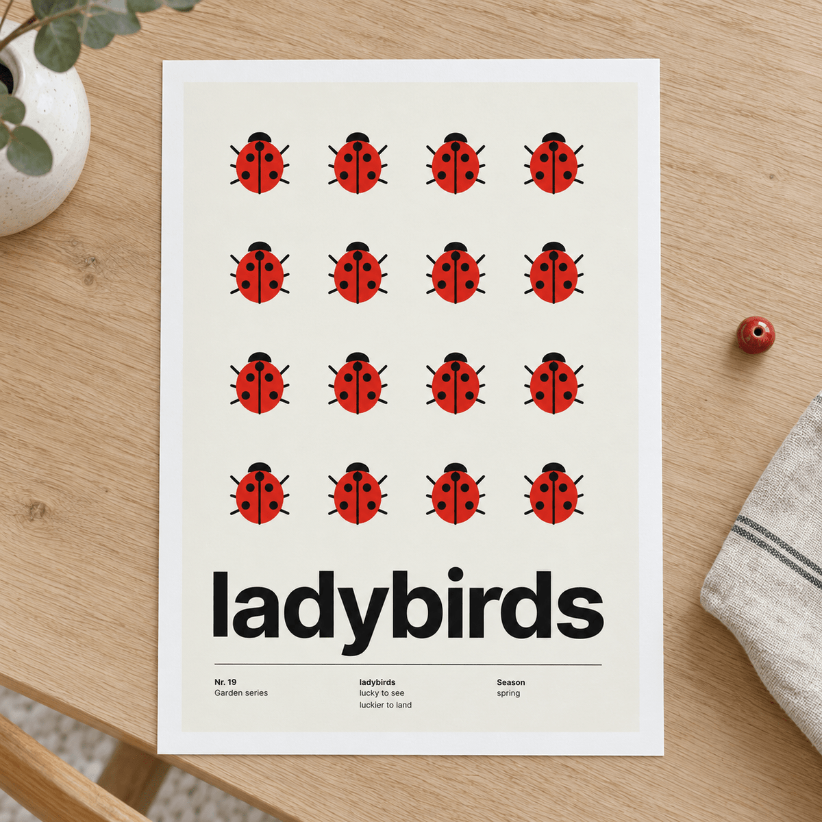 Close view of the Swiss style ladybird print on smooth matte paper