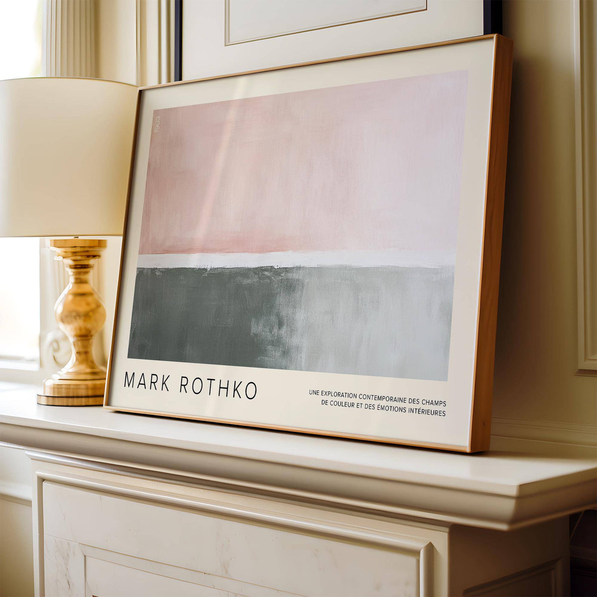 Horizontal wall decor with abstract blocks in pink and grey leaning on a white mantel with a lamp