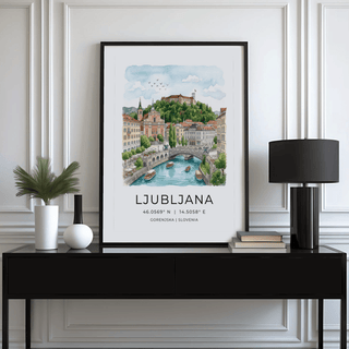 Ljubljana art print of river view with boats in watercolour style above black sideboard with lamp