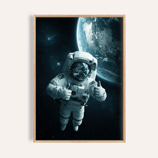 Framed close-up of astronaut wall art showing an astronaut in space with Earth in the background