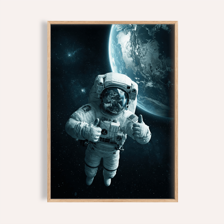 Framed close-up of astronaut wall art showing an astronaut in space with Earth in the background