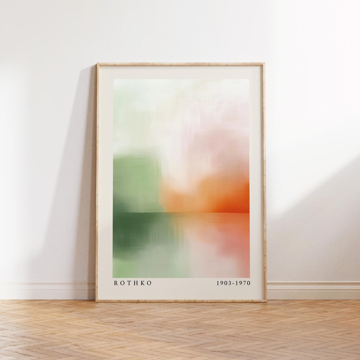 Peaceful wall art leaning on floor with abstract sunset landscape in soft green and orange
