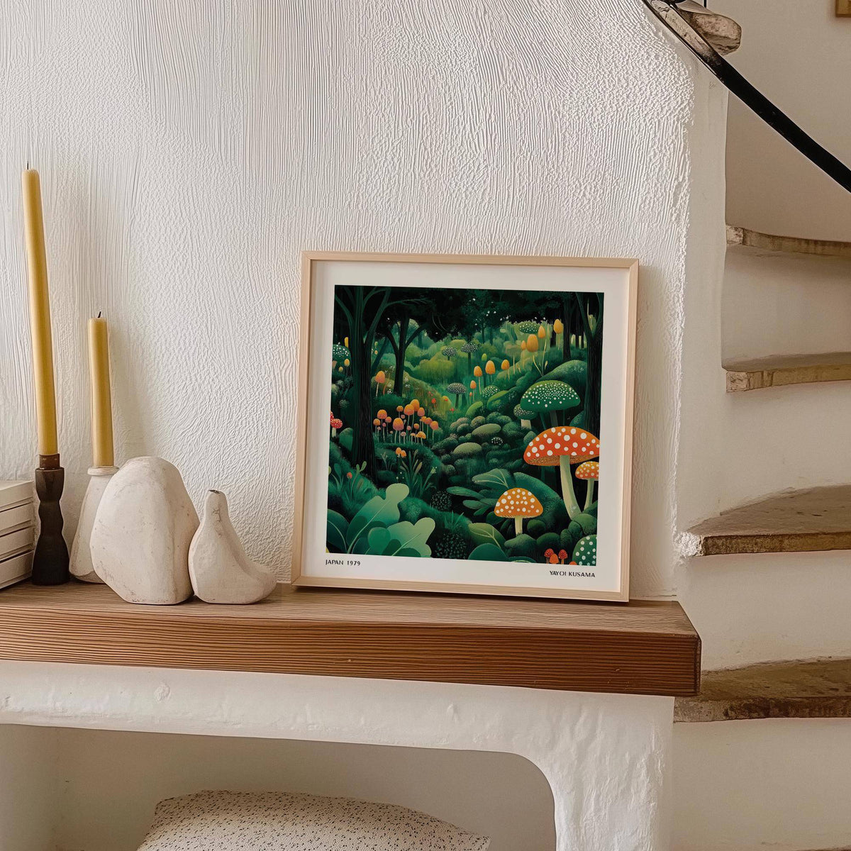 Enchanted Forest wall art with colourful mushrooms leaning on a wooden shelf next to candles and sculptures