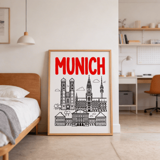 Munich City Poster leaning on a floor with minimalist black and red line-art in a bedroom next to a bed